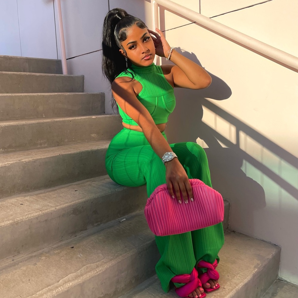 This pant set consists of a fitted halter crop top and an ultra high-waist pant.
